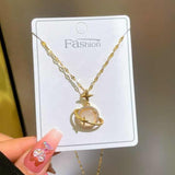 Delicata collana girocollo con ciondolo a forma di occhio di gatto in opale, da donna, in acciaio inossidabile, con luna, stella e pianeta